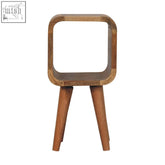 Extra mini minimalist open curved oak-ish bedside table with open shelf and tapered legs in natural wood finish