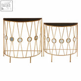 Faiza set of 2 cross design console tables with gold-toned metal, mirrored circular accents, and dark wood tops in art deco style