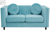 A farah two seat green velvet sofa in light blue velvet with tufted cushions and dark wooden legs