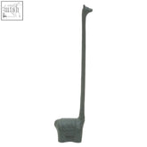 Dark green cast iron giraffe-shaped candle holder with textured pattern, not a toilet roll holder or roll holder