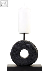 Black textured mango wood log candle holder with a white cylindrical candle atop for cozy ambiance