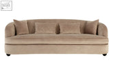 Beige cotton velvet sofa with quilted back cushions and rounded arms in the style of a fiji three seat grey cotton velvet sofa
