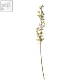 Delicate artificial pink cherry blossom spray with soft pink flowers and green leaves on a slender brown stem