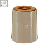 Beige ceramic tea canister with a wooden lid perfect for storing loose leaf tea or tea bags