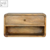 A rustic light brown mango wood floating curve open slot bedside table with single drawer and brass knob