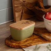 Floral engraved sage green butter dish with olive ceramic base and natural wood lid for stylish butter storage