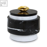 Flos black marble cylindrical storage jar with black and white marble body and gold lip-shaped lid