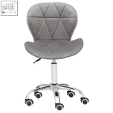 Gray quilted velvet office chair with chrome base and casters perfect for a stylish home office space