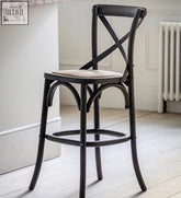 Dark-finished wooden french bistro bar stool with hand woven beige rattan seat and x-shaped backrest solid rattan frames