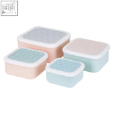 Set of four pastel frosted deco snack boxes with textured lids and white rims perfect for stylish storage