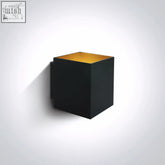 Black cube-shaped aluminium decorative wall light with gold interior lining for stylish decorative wall use