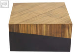 A gabor coffee table with a light wood top and dark metal base perfect for modern living rooms