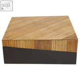 A sleek gabor large coffee table with a light wood grain top and dark matte base in a rectangular shape