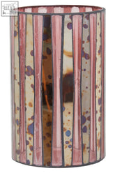 A large candle holder with gaia pink vertical stripes and purple brown speckles in a cylindrical glass design