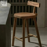 Minimalist wooden gaku bar stool with smooth light brown finish and sturdy legs perfect for any gaku bar setup