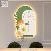 A modern garden style flower luminous clock with a white face green leafy accents and warm backlighting
