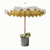 A charming yellow and white garden umbrella with a removable canopy and hardwood frame featuring a damask pattern