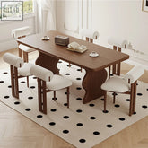 Gavin dining table in walnut and ash wood with a sleek modern design and curved legs dining table