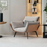 Modern genevieve armchair with tan leather upholstery light gray cushions and black metal legs for stylish seating
