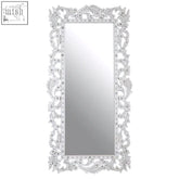 Geonna wall mirror with tall white frame featuring intricate baroque-style carvings and decorative embellishments