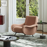 A plush dusty rose georgios lounge armchair with soft linen fabric and sleek black metal legs perfect for relaxing