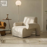 Cream-colored linen armchair with plush upholstery and modern sculptural design perfect as single sofa seating
