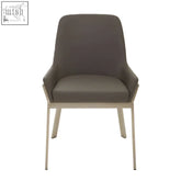Modern grey faux leather dining chair with sleek metallic legs perfect for stylish faux leather dining spaces