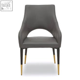 Modern gilden grey leather effect dining chair with grey upholstery and sleek black gold tip legs