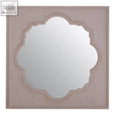 Gladys fossil grey wall mirror with a square frame, distressed pinkish-grey finish, and ornate quatrefoil design