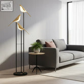 Modern gold bird led floor lamp with three illuminated figures on slender black poles perfect for bedroom lighting