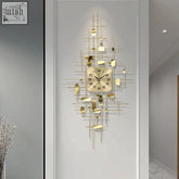 Gold clock with modern geometric design featuring gold-toned metal rods and oval-shaped accents for wall decor