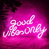 A glowing pink led acrylic good vibes neon wall sign with cursive script for bedroom bar party decor 16.5 x 9.4 inches