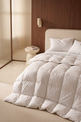 White quilted goose feather and down duvet with soft plush texture and clean modern design