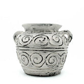 A rustic cream greek clay plant pot with two handles and decorative spiral patterns perfect for plants