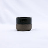 Minimalist grey handmade ceramic espresso mug with glossy black top and textured smoked grey handmade stoneware bottom
