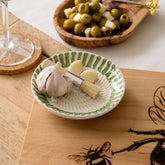White ceramic garlic grater with green stripes and fluted rim perfect for ceramic garlic use and grating