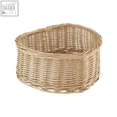 A light beige heart shape willow basket made from tightly woven natural fibers in a rounded rectangular shape