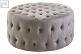 Haley grey velvet round tufted footstool with grey velvet material and dark button accents perfect for extra seating