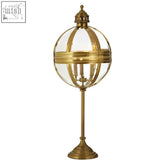 Hampstead brass finish table lamp with brass globe lantern, clear glass panels, and ornate detailing