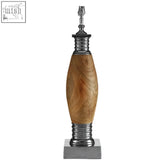 Elegant wooden lamp base with polished brass and metallic accents for a curved tabor lamp design