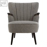 Hampstead grey fabric armchair with tufted backrest and black wooden legs in soft grey fabric armchair design