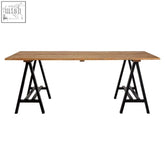 A sleek hampstead pine wood dining table with black metal a-frame legs perfect for minimalist dining spaces