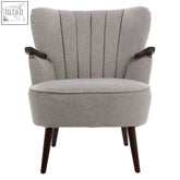 Gray taupe fabric armchair with vertical pleats and dark wood arms and legs perfect for cozy living rooms