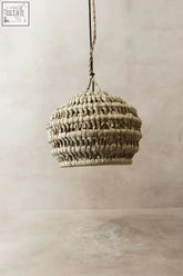 Beige woven pendant shade made from ilala palm with a textured handcrafted design for cozy lighting