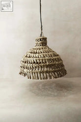 Handmade beige woven pendant lamp with fringed edges made from ilala palm dried leaves from mozambique