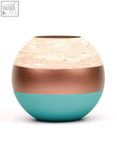 A handpainted glass vase with quality materials featuring a textured cream top copper band and teal bottom for home decor