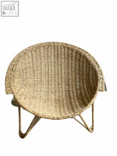 Natural woven wicker handwoven sun chair from mozambique with rounded cozy seat and slender legs