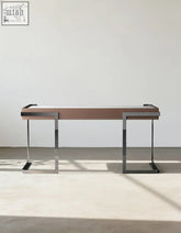 Modern minimalist hank office desk with sleek brown wooden top and chrome legs ideal for home office desk setup