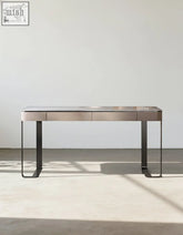 Minimalist office desk with brushed metal top and black steel legs featuring two drawers for a functional office desk setup
