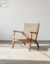 Hans ch25 oak armchair designed with oiled oak frame and natural woven cord seat and backrest in beige